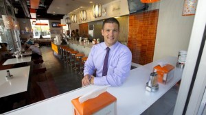 Mike DiNorscia is co-founder of Location Matters, a restaurant brokerage firm, and Sweet 100, which invests in new dining spots, including the Burger Lounge in Little Italy where he's seated. — Earnie Grafton